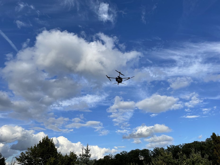 The AERIS Recon S7 during a flight against a blue sky in a real-world testing environment.
