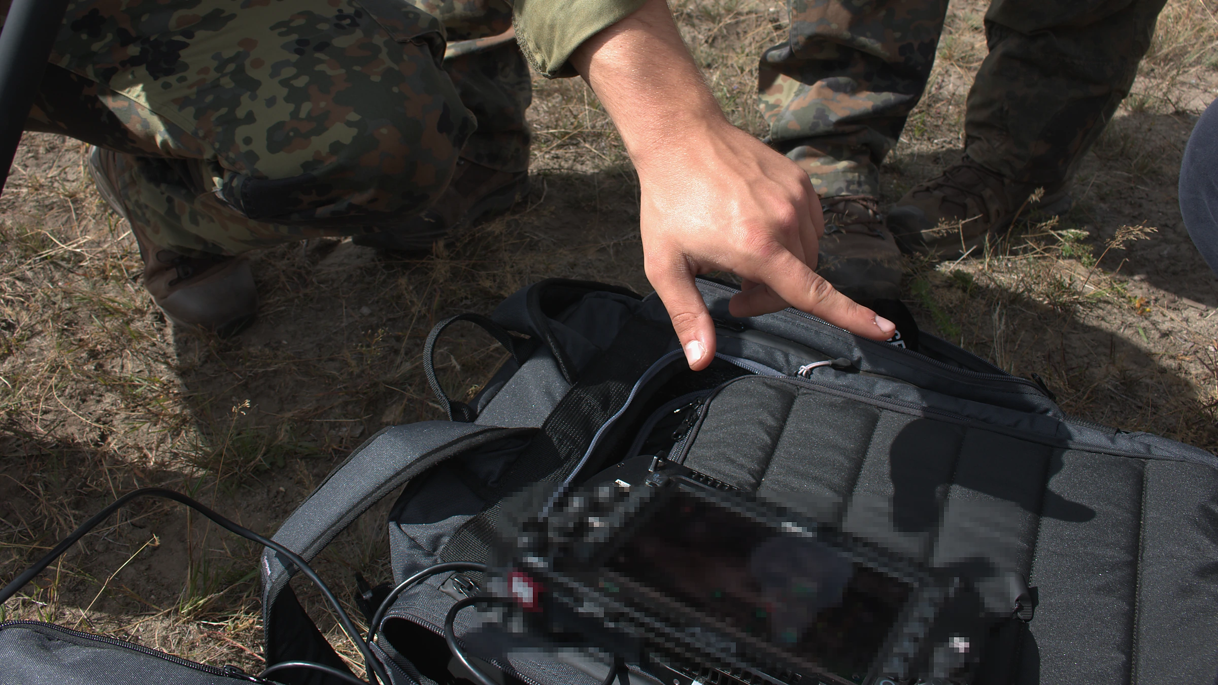 Operators checking the ground control station and data transmission of a Vectorbirds UAV