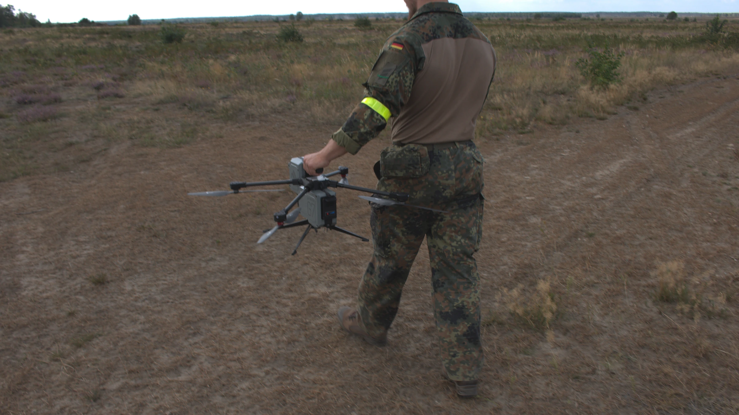 Soldier carrying a compact Vectorbirds UAV during a field trial