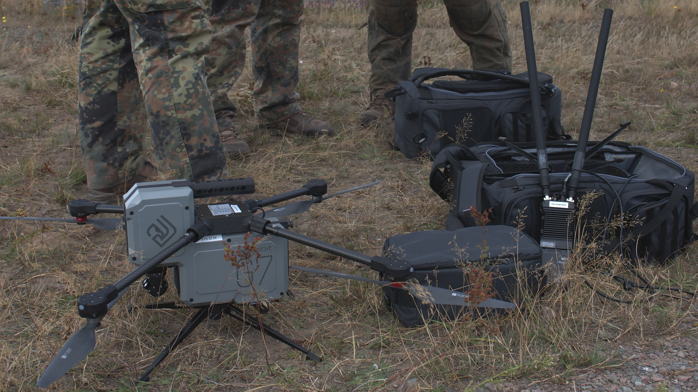 Vectorbirds UAV with radio, antennas and mobile system equipment during a field trial